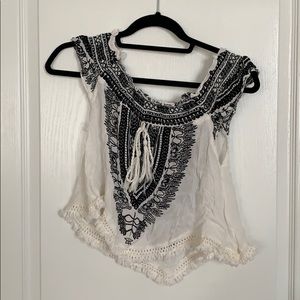 Embroidered peasant style cropped shirt.